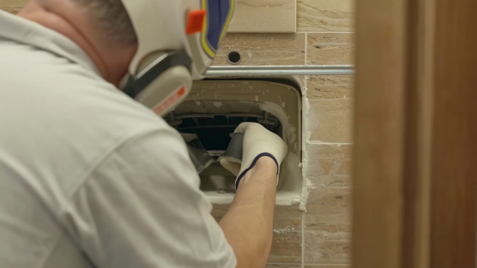 Restoration technician illustrating: The bathtub overflow drain: the backup protection that sometimes is not connected to anything