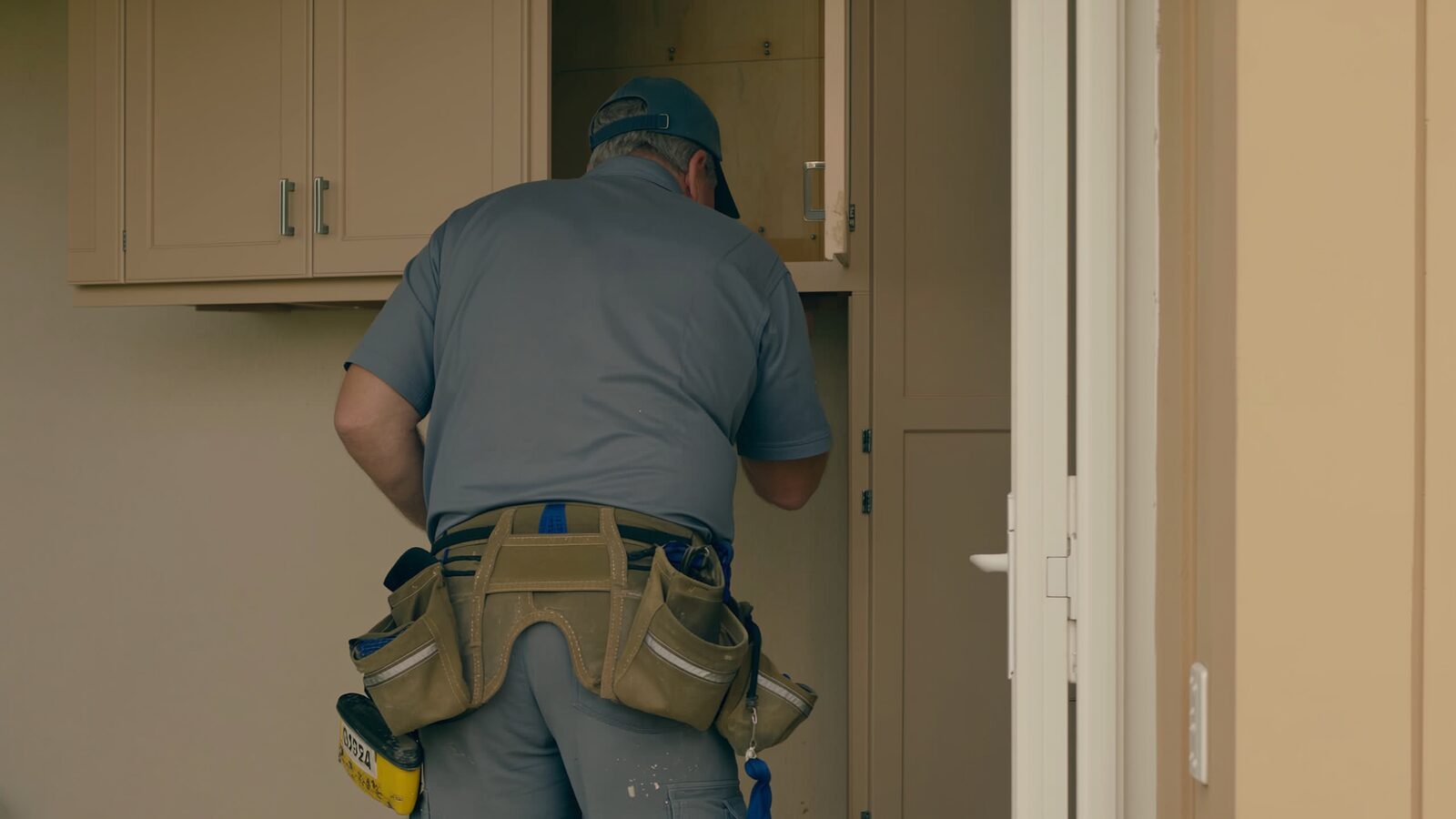 Restoration technician illustrating: Refacing cabinets versus replacing them after damage