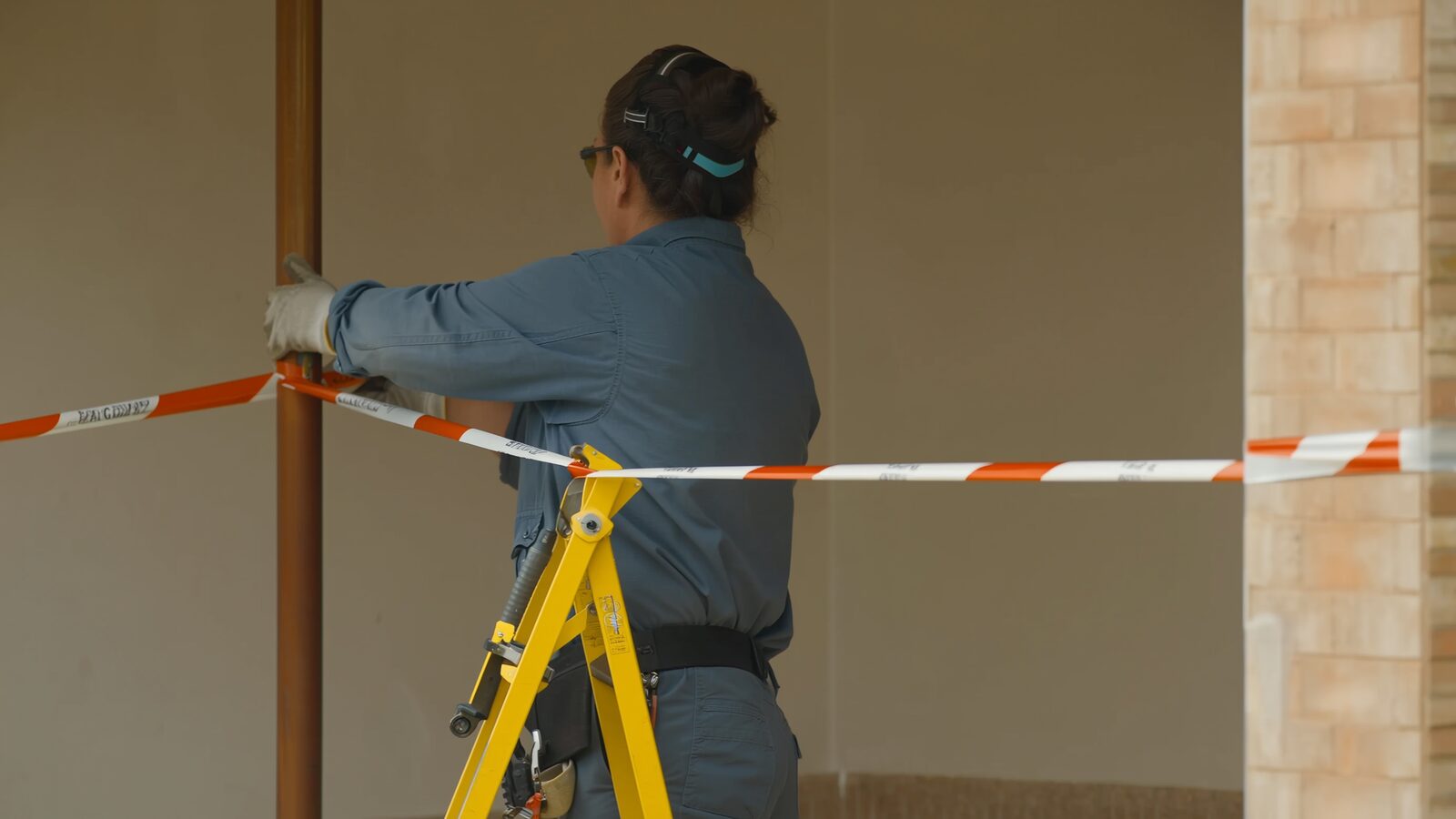 Restoration technician illustrating: Why containment barriers go up, and what they are protecting