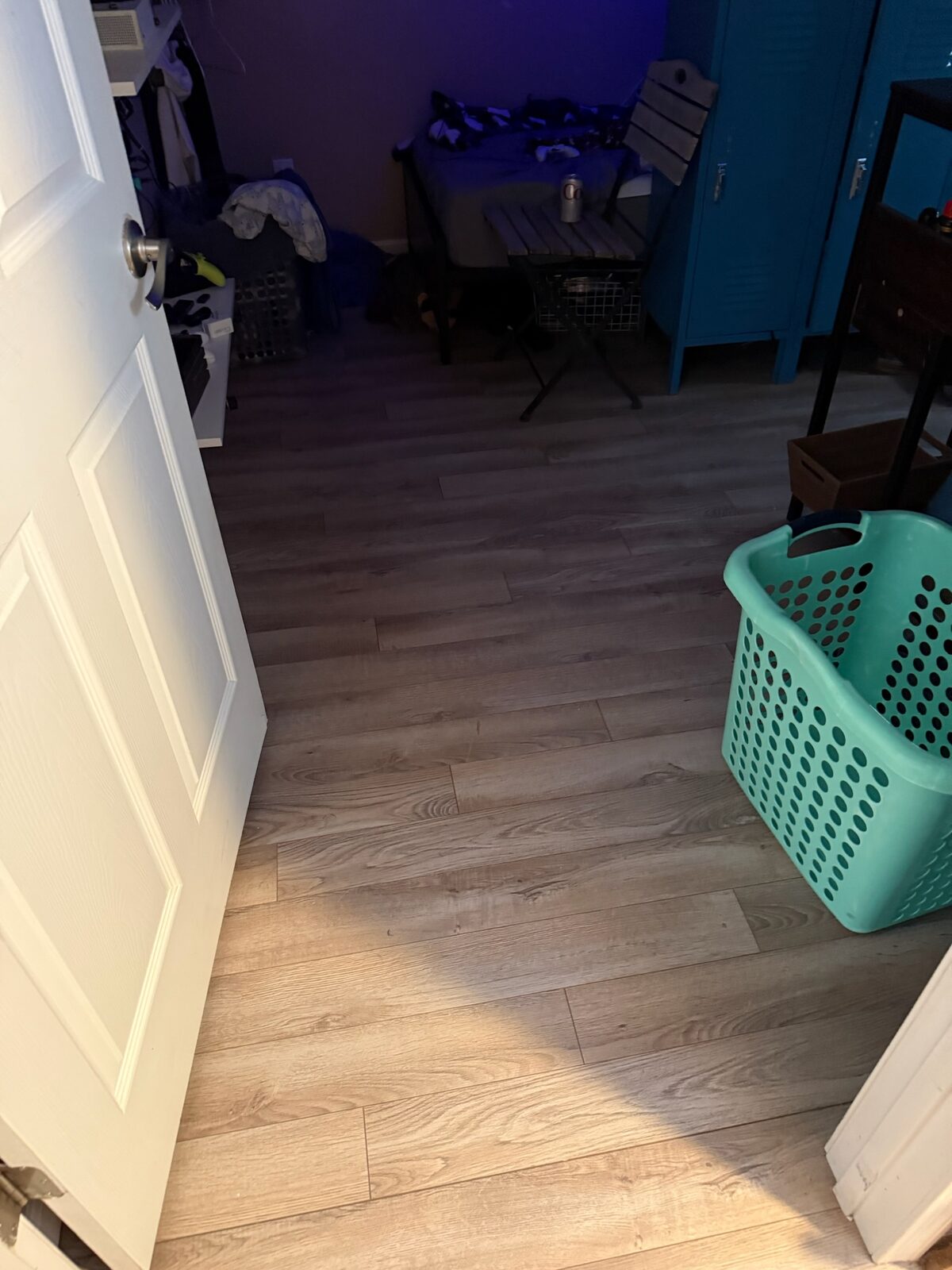 Wood-look plank flooring installed in a bedroom viewed from the doorway