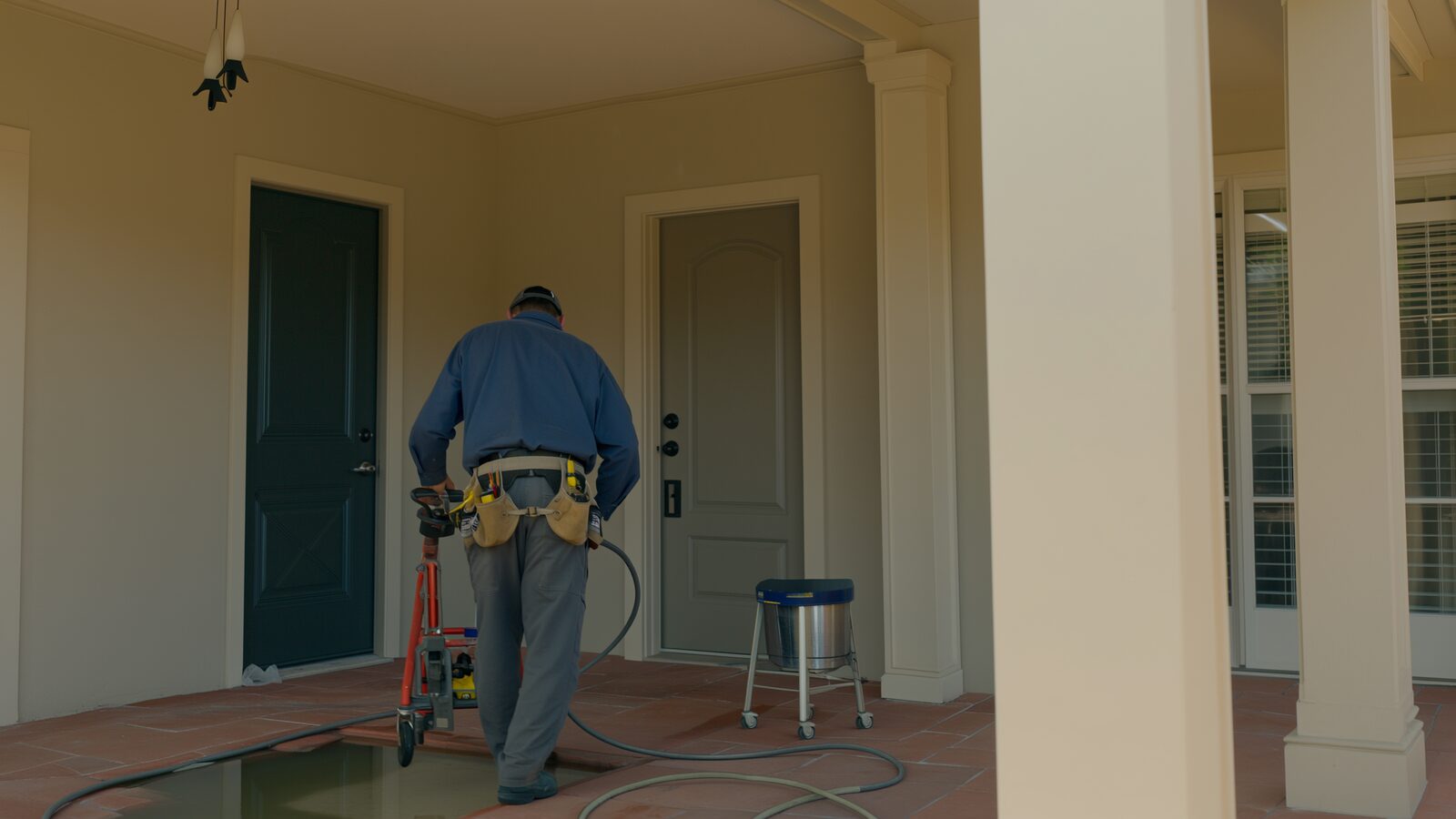 Restoration technician performing water damage restoration work at a property in El Mirage, Arizona