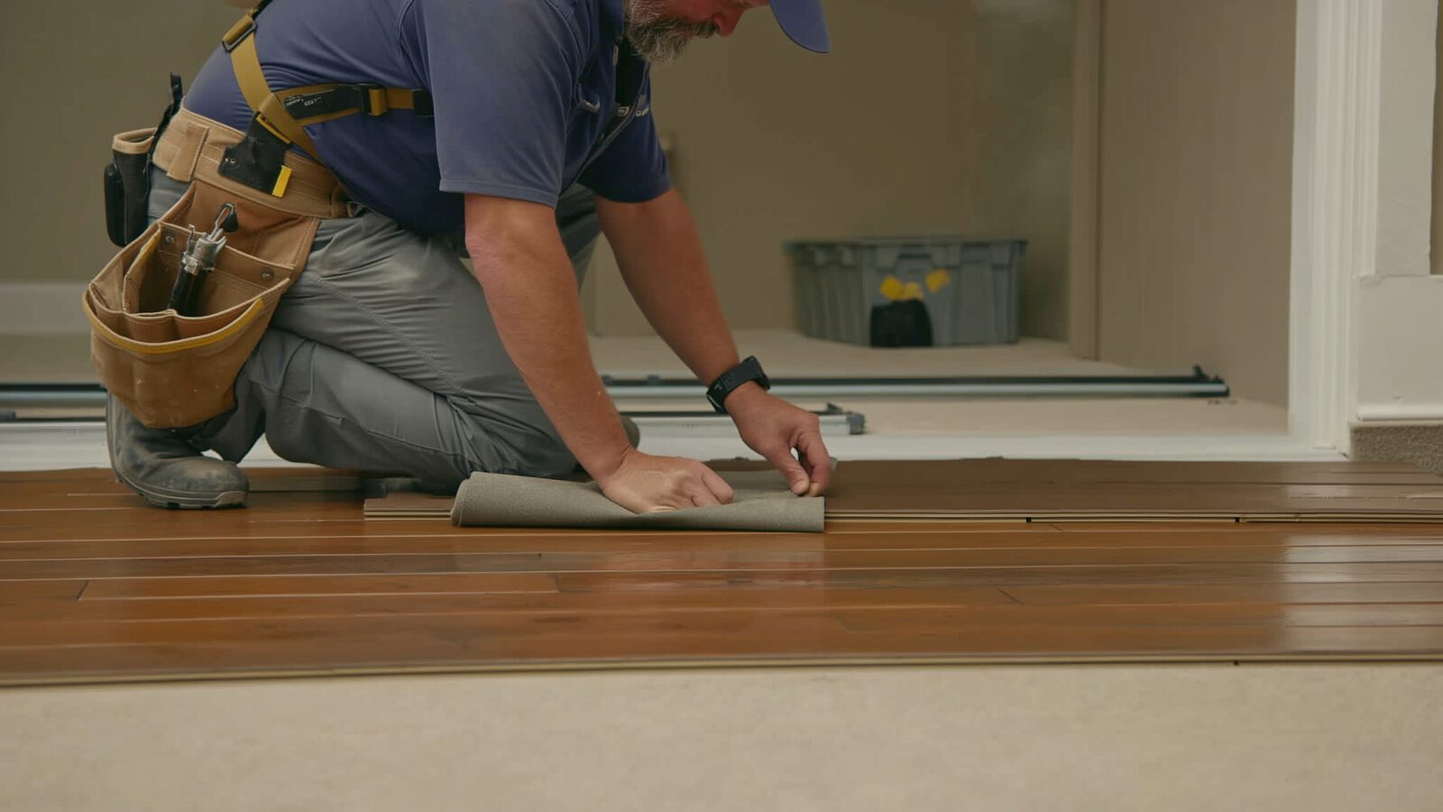 Restoration technician illustrating: Luxury vinyl plank after water: waterproof flooring over a floor that is not
