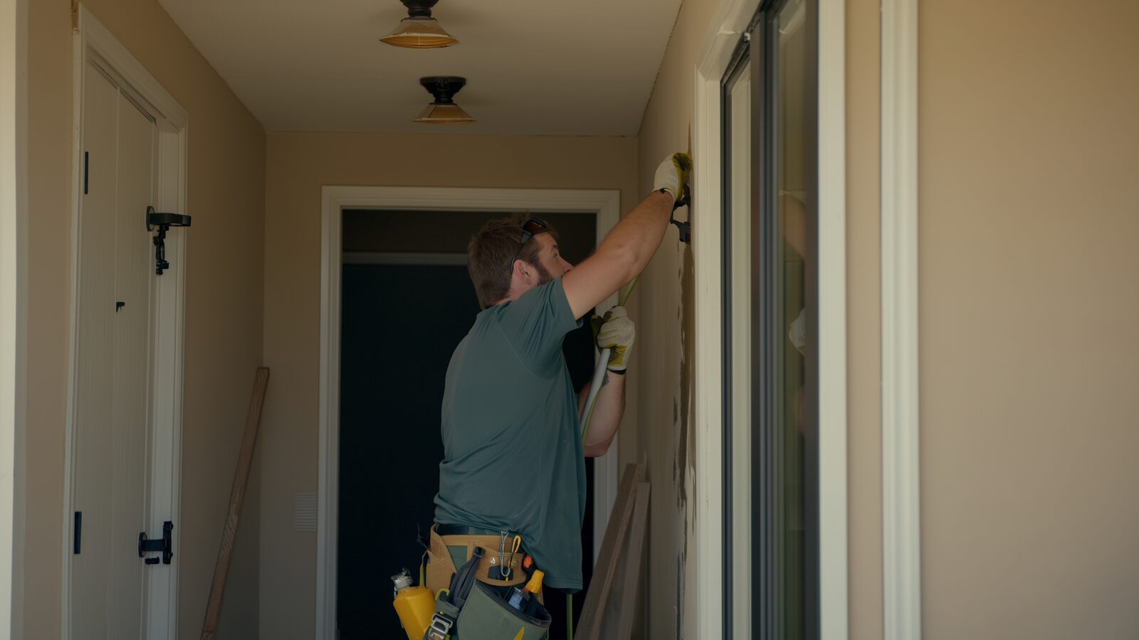 Restoration technician performing water damage restoration work at a property in Mesa, Arizona