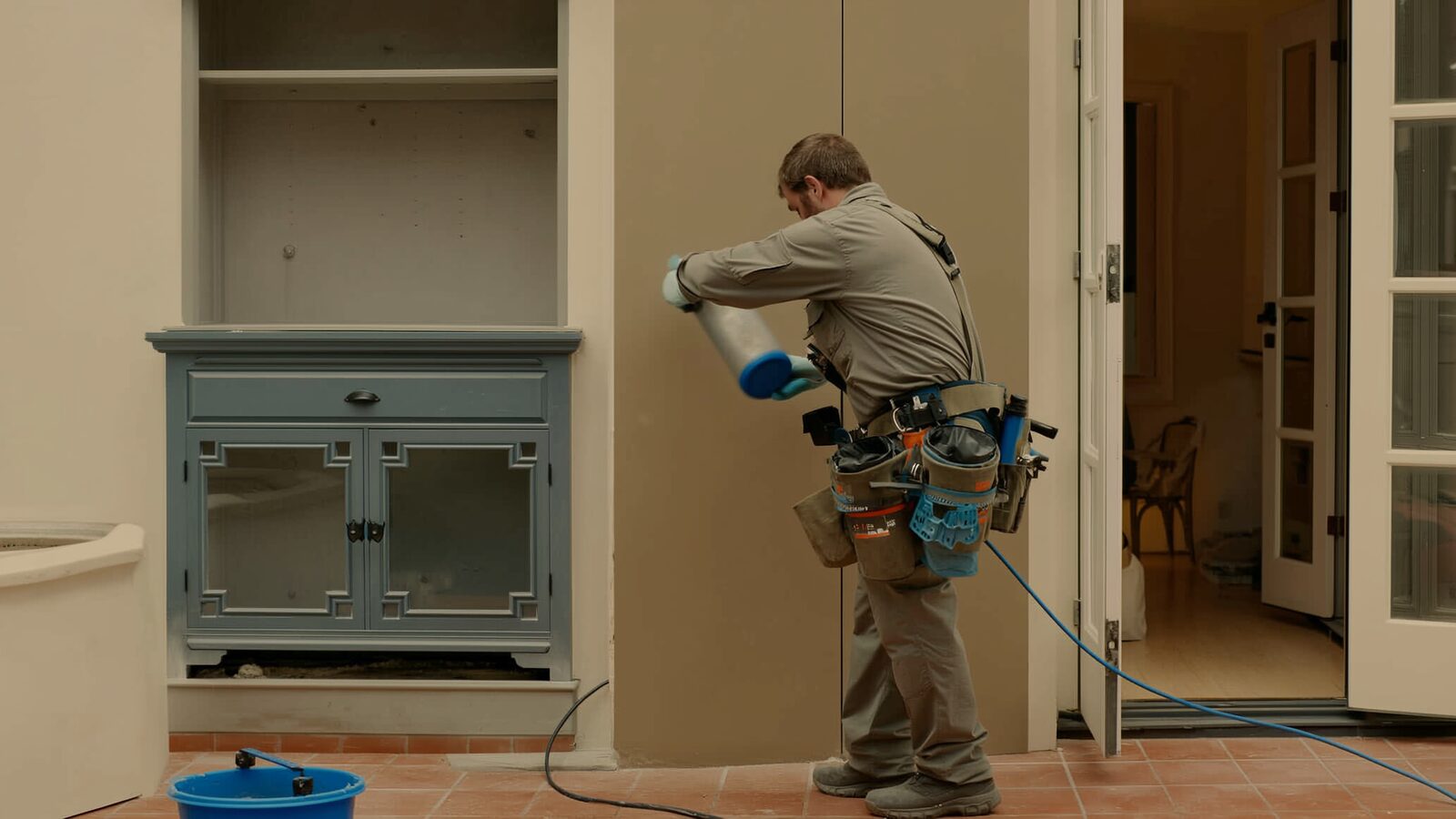 Restoration technician illustrating: Mold behind furniture and in closets: airflow dead zones