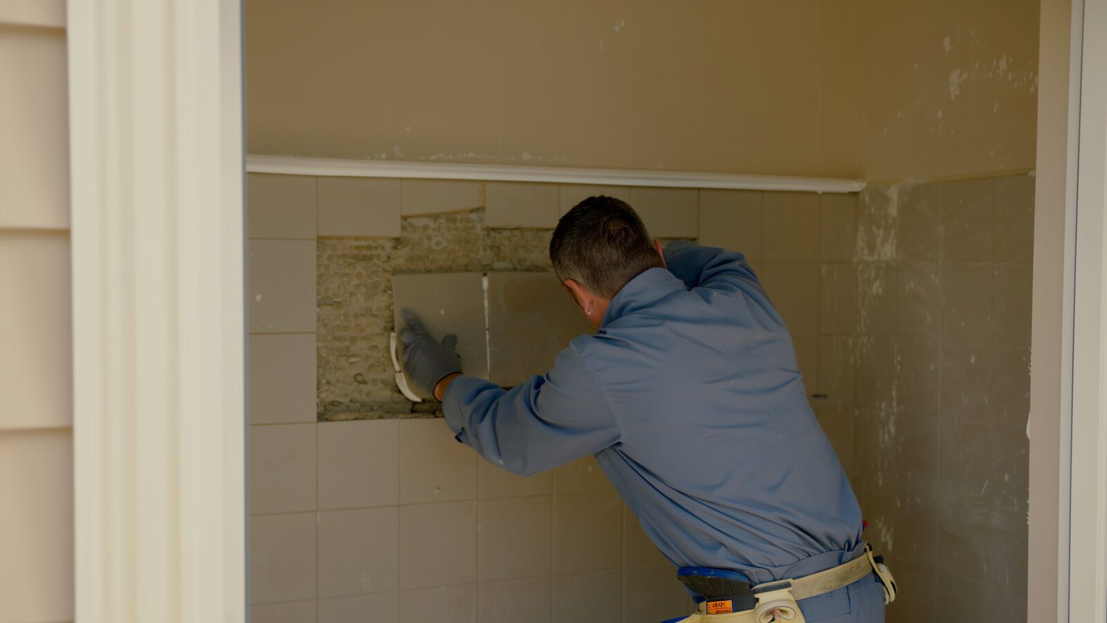 Restoration technician illustrating: Water damage under tile and what grout tells you about it