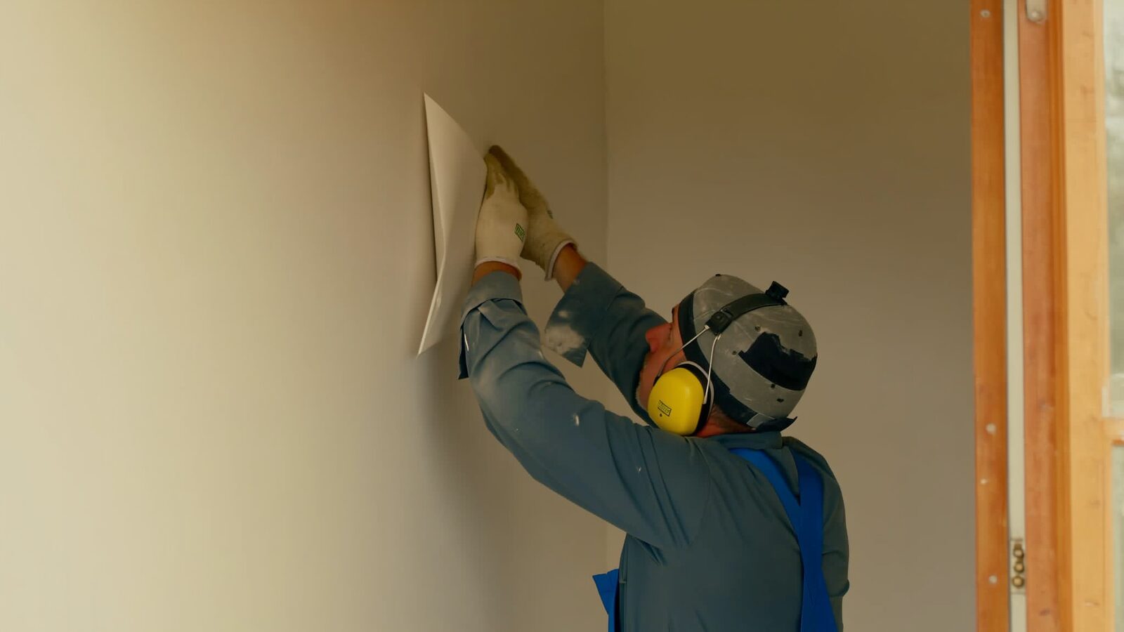 Restoration technician illustrating: When drywall can be dried in place and when it has to come out